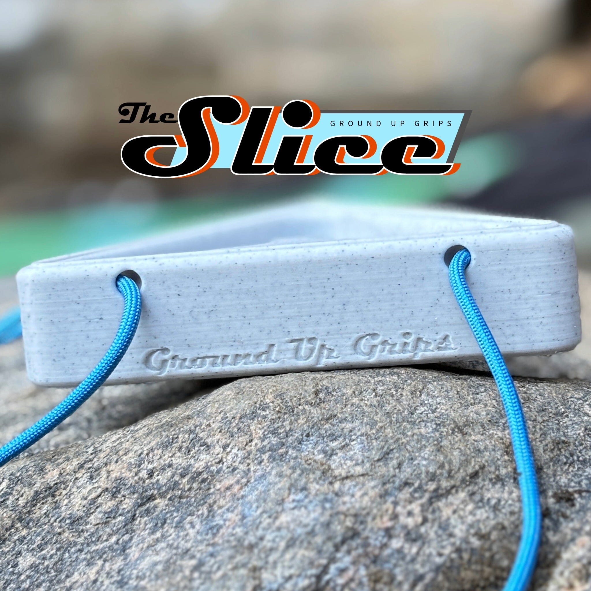 Warm up block with blue strings on a rock, featuring 'The Slice' brand logo.
